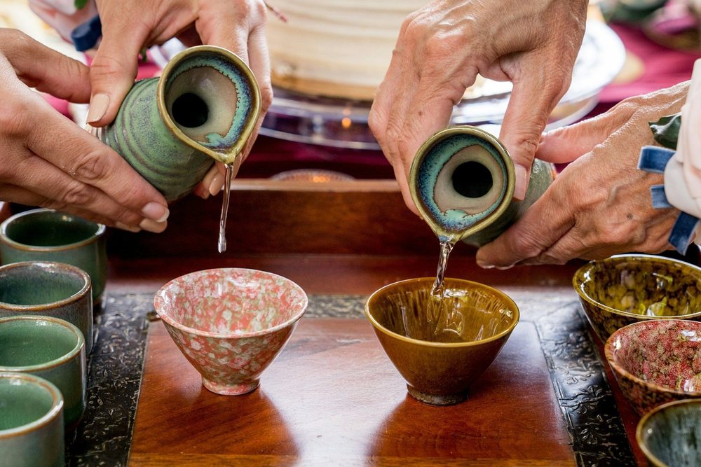 Sake poured into cups